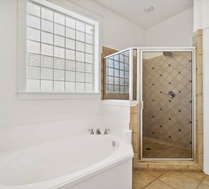 2nd Floor Primary Ensuite - Featuring a Soaking Tub and Walk-in Shower
