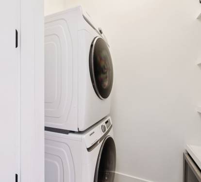 Stack Washer & Dryer + Mini Fridge in the Laundry Room