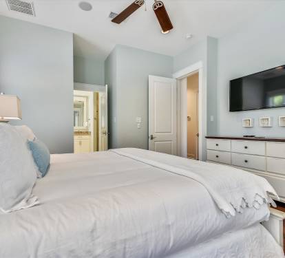 A bright, inviting first floor primary bedroom for a peaceful stay.