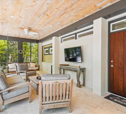 Cozy Seating on Porch with TV