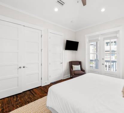 Primary King Suite - Offering Ample Storage & a Flat-Screen TV!