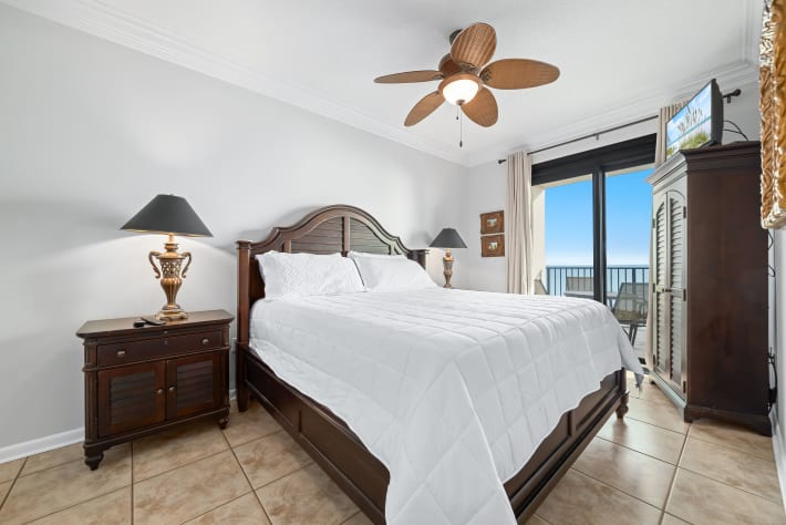 Main bedroom with king size bed and direct balcony access