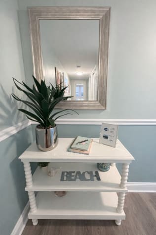 Coastal decor throughout condo.