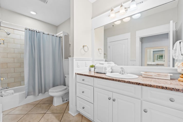 Spacious full bath with double vanity and modern finishes. Plenty of room for families to get ready with ease, stocked with fresh towels and thoughtful touches to make your stay stress-free.
