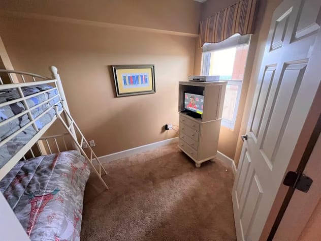 This bedroom is the perfect space for the kids to occupy, featuring a bunk bed with 2 twin beds.