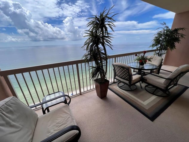 Our lovely balcony enclosed with patio furniture and 3 chairs with cushions for added comfort.