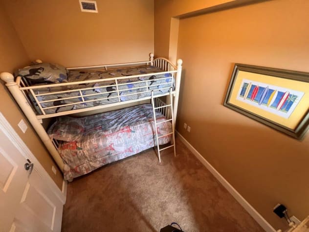 This bedroom is the perfect space for the kids to occupy, featuring a bunk bed with 2 twin beds.