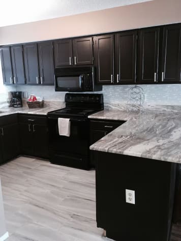 Spacious kitchen. Stocked with appliances and kitchen utensils
