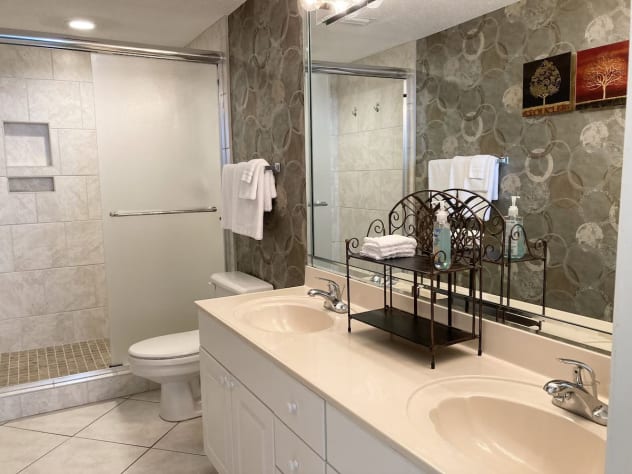 Custom step-in shower and double vanity in the master bathroom
