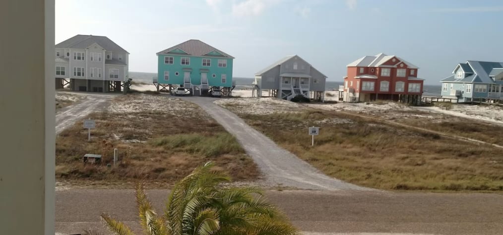 View of Gulf from porch; the perfect place to sit &amp; rock, see and hear the waves
