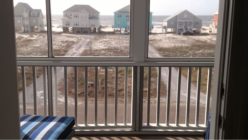 View of Gulf from 2nd story screened-in balcony; relax, enjoy the view &amp; sounds