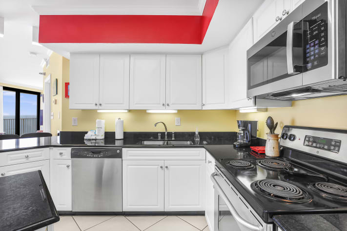 Fully equipped kitchen with modern appliances, perfect for home cooking.