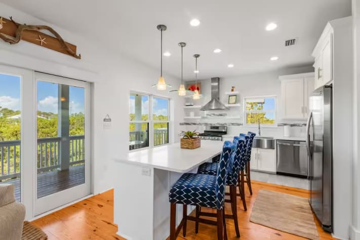 Completely updated in 2024 with fully stocked kitchen including seperate icemaker under the kitchen island, gas stove, oven, farmhouse sink, dishwasher, refrigerator and microwave - lots of pots, pans, chacuterie board, Bose blue tooth.