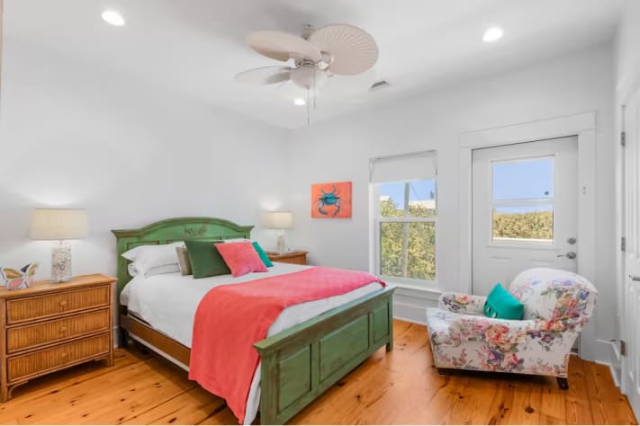 Master Bedroom with ensuite full bath and private balcony in front of house.