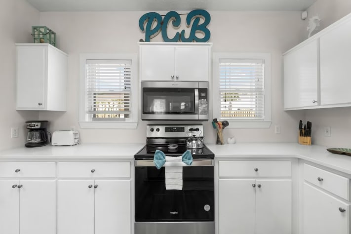 Fully equipped kitchen with modern appliances, perfect for home cooking.