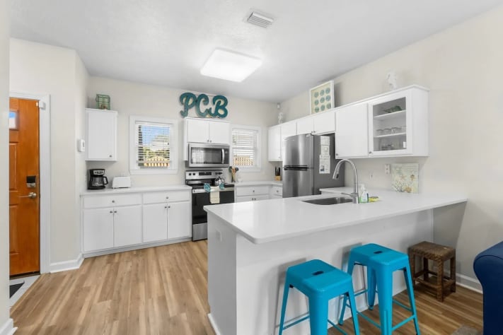 Open kitchen space with kitchen island and seating space