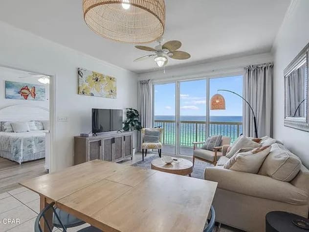 Open living room with bedroom and balcony access&mdash;bright space and stunning views