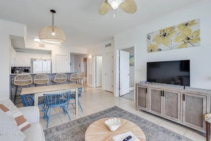 Relaxed living, dining, and bar area&mdash;coastal comfort with bright, inviting style