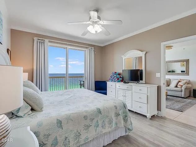 Relaxing bedroom with balcony access&mdash;wake to serene Gulf views and coastal charm
