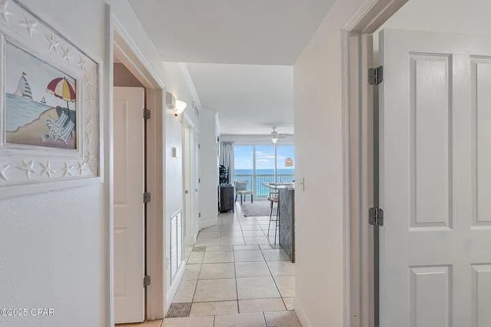 Inviting entryway leading to bright turquoise Gulf-views from the living space