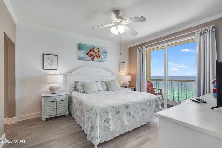 Relaxing bedroom with balcony access&mdash;wake to turquoise Gulf views and sea breeze