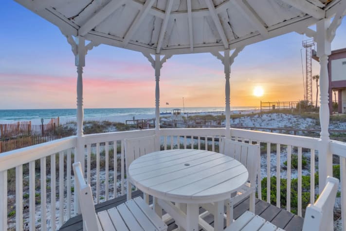 Charming beachside retreat featuring expansive outdoor spaces and direct sand access.