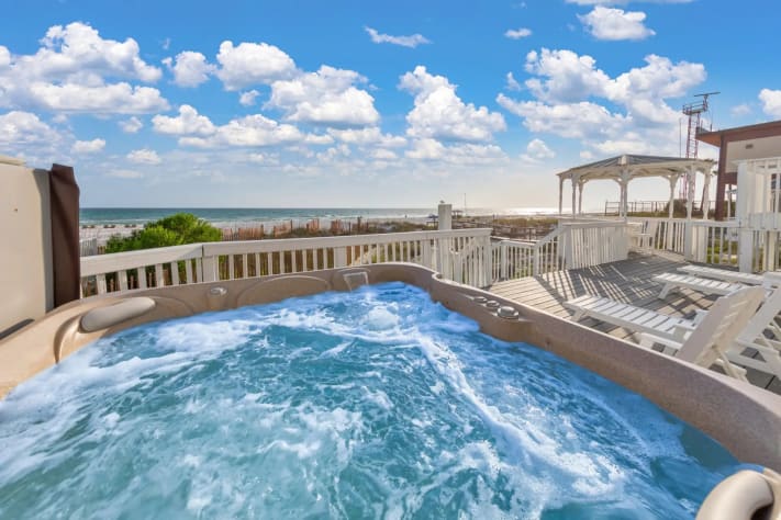 Relax in your private hot tub with stunning ocean views and endless skies.