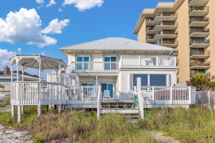 Spacious beachfront home with stunning decks, perfect for your coastal getaway.