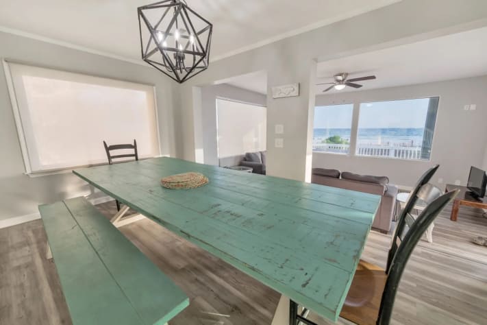 Rustic-style dining table with plenty of natural light and coastal charm.