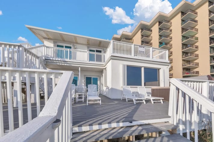 Prime beachfront home offering direct beach access and stunning panoramic views.