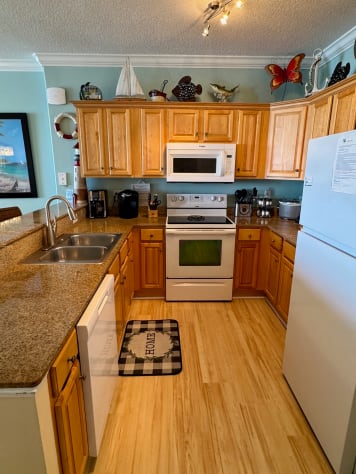 Granite counters,  updated lighting and brand new LVP flooring. 