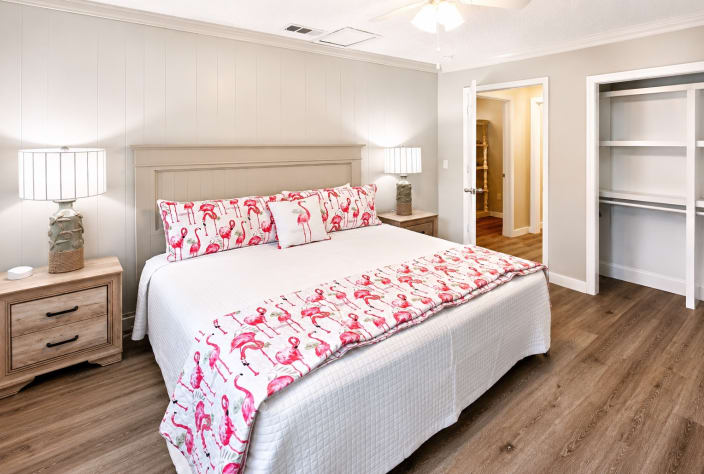 A King Suite with an en-suite full bathroom features a private primary bedroom with a king-size bed and an attached, dedicated full bathroom.  