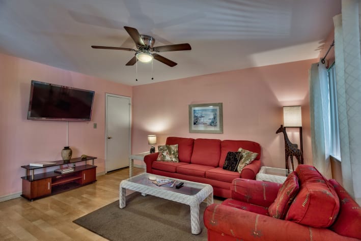Spacious living area with large flat screen tv