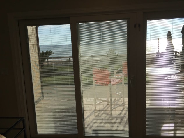 LIFT UP THE BUILT IN MINI BLINDS.........