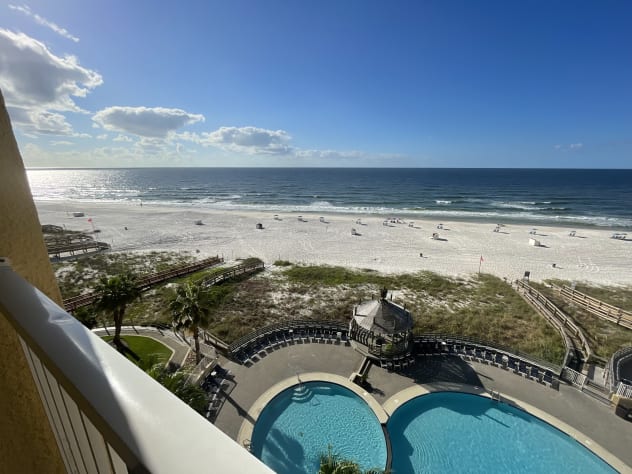 View out to the balcony &amp; beach. Chairs &amp; umbrella service available.