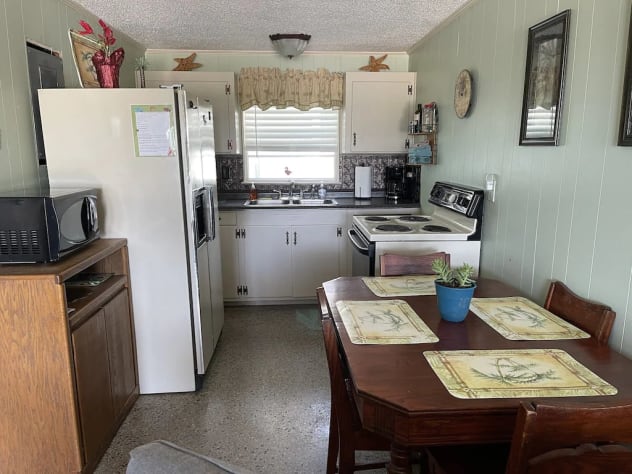 Full size fridge, stove, microwave,  dish/cutlery sets &amp; cookware/utensils  