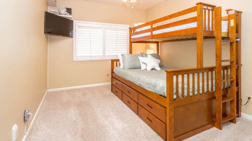 3rd bedroom with bunk beds and TV
