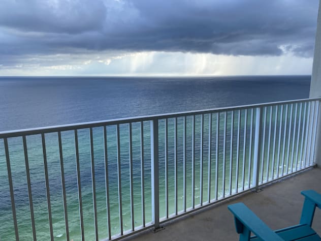 Spacious balcony is the perfect place to watch waves and summer rain