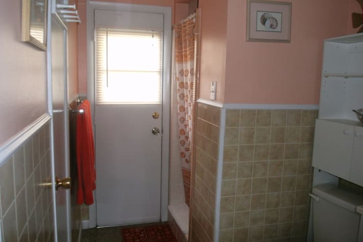 Private door to the outdoor enclosed shower. 