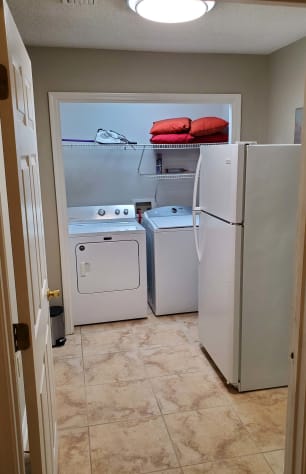 Laundry room with second fridge