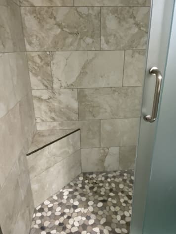 First floor bathroom with walk-in shower with barn doors