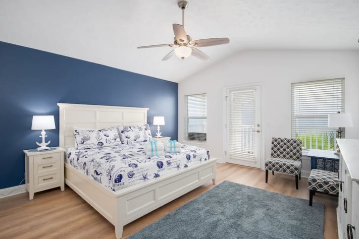 Master bedroom with 40&rdquo; smart tv, private covered balcony and sunning deck. 