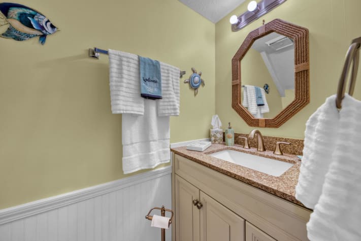 Beachy decorated  half bath Check out the Mermaid