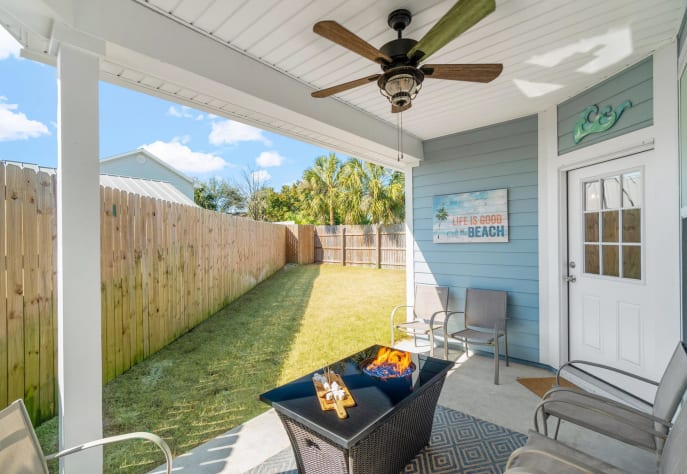 Outdoor seating with fire pit table and propane grill