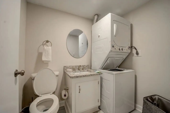 half bathroom with new washer and dryer 