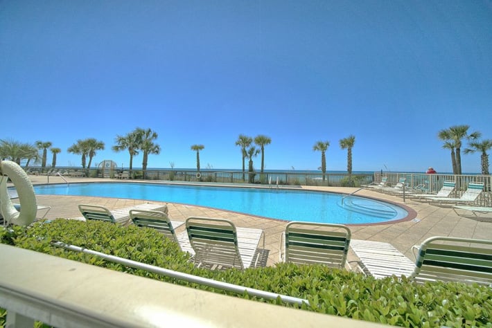 When we say poolside....we MEAN poolside! Patio gates open directly to the pools