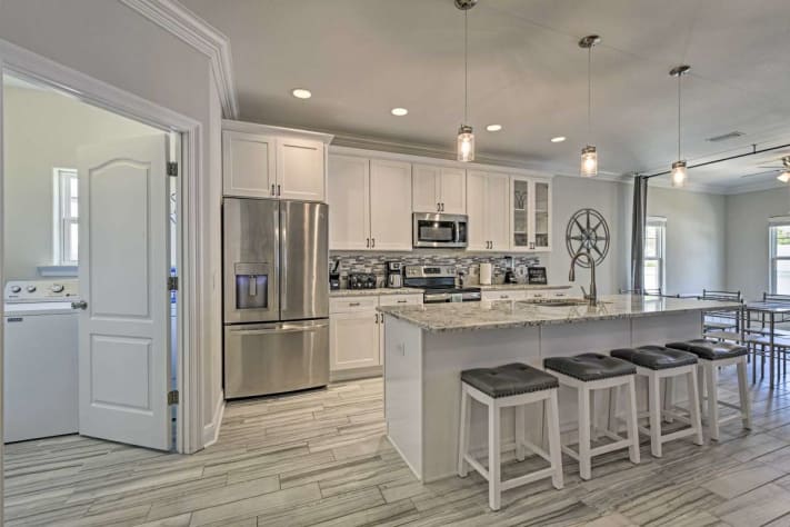 The kitchen has plenty of room for gathering and food prep or dining