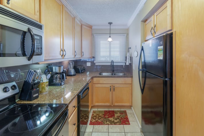Granite counter tops, custom made cabinetry, all new appliances in kitchen
