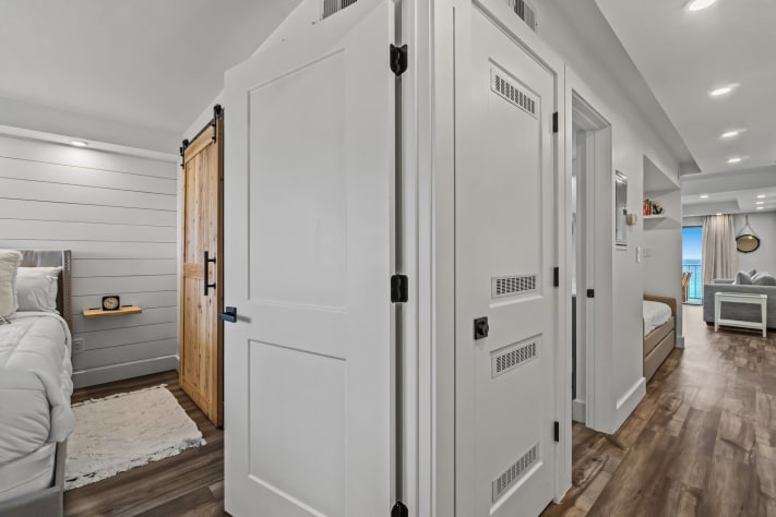 Hallway to bedroom, common area, living room, and bathroom