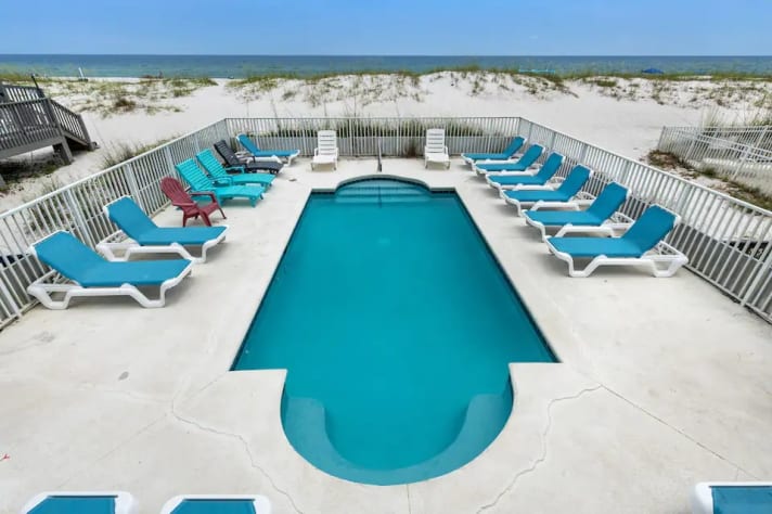 Pool with sun deck chairs